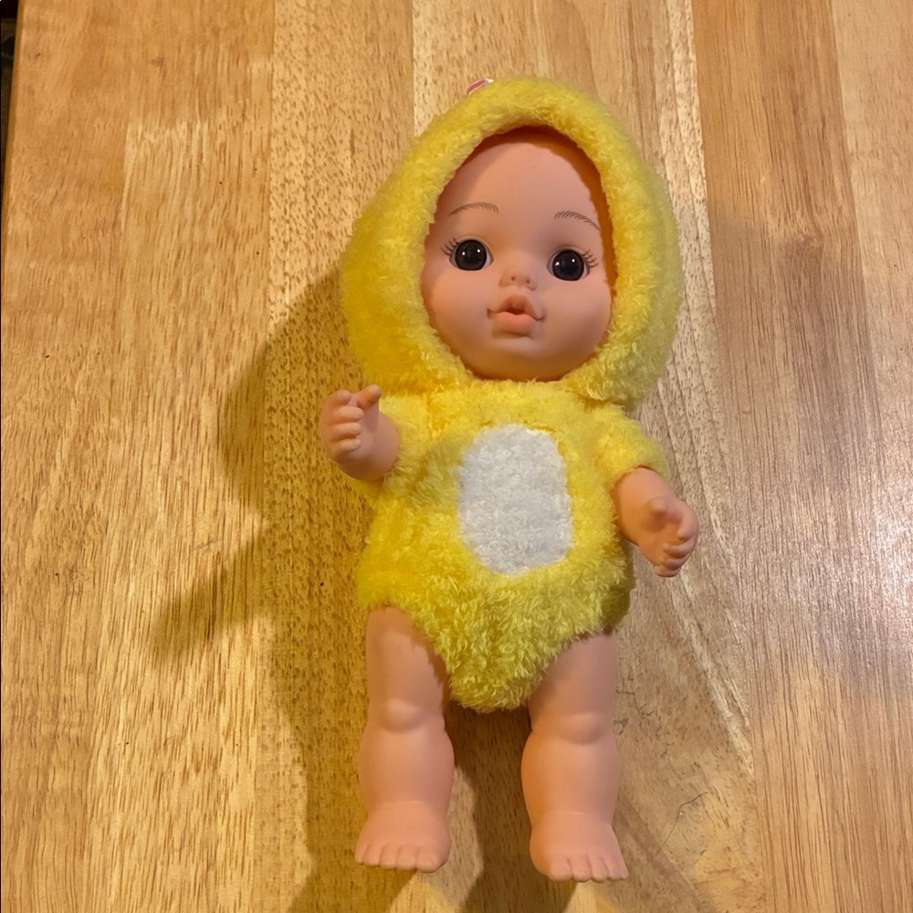 Yellow Plush Baby Doll With Duck Costume on. The Costume is Removable